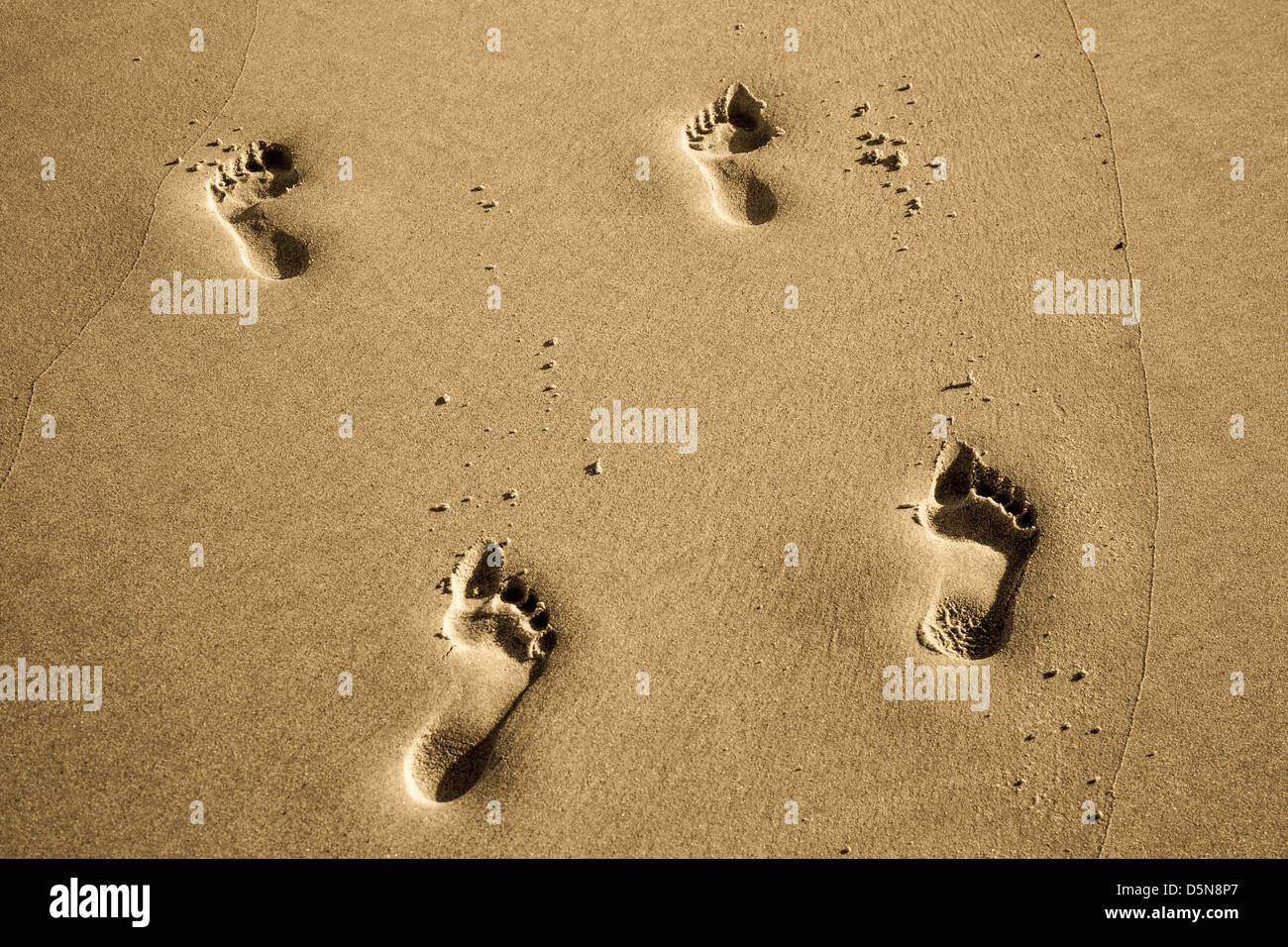 Foot Prints On Beach Stock Photo