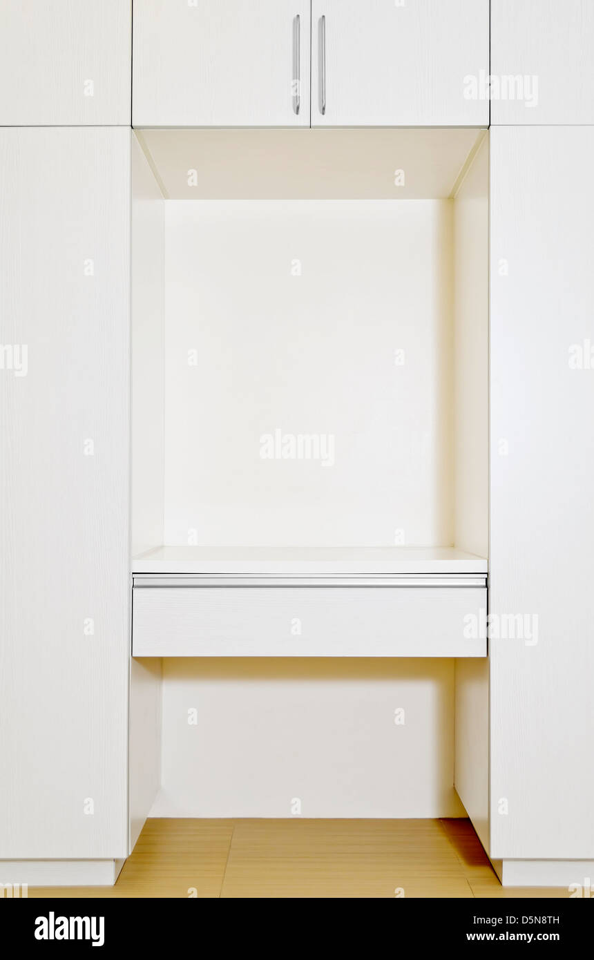 Built-in cabinet in room of an unoccupied newly-built apartment. Stock Photo