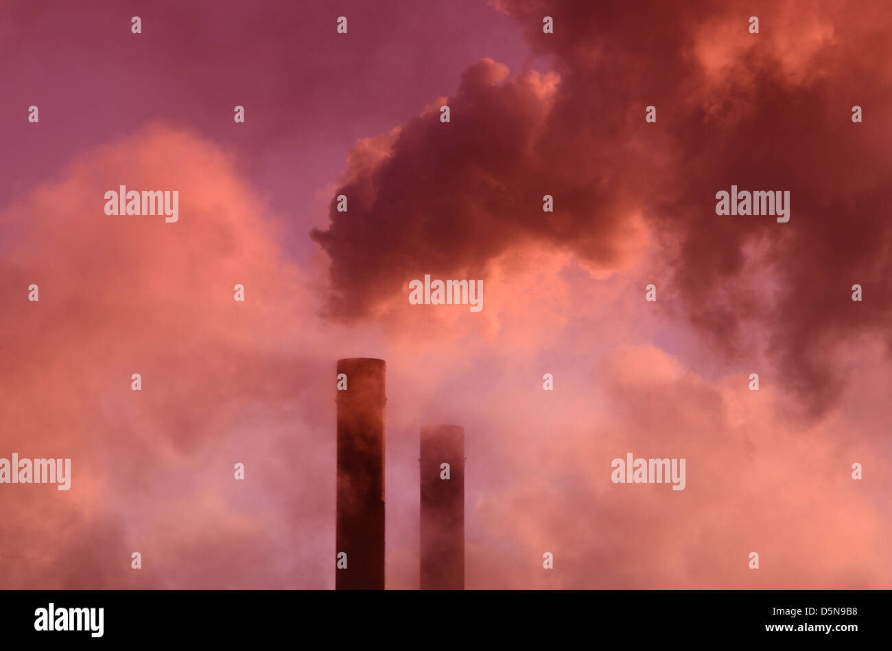 smoke billowing from ferrybridge power station chimney at sunrise United Kingdom Stock Photo