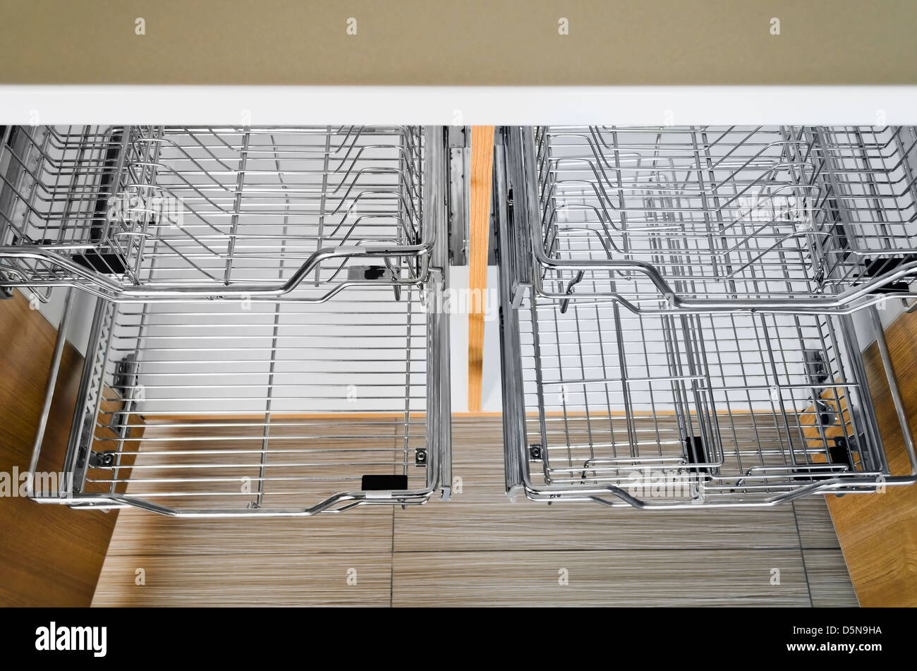 Open Kitchen Cabinet With Two Layers Of Stainless Dish Rack Stock