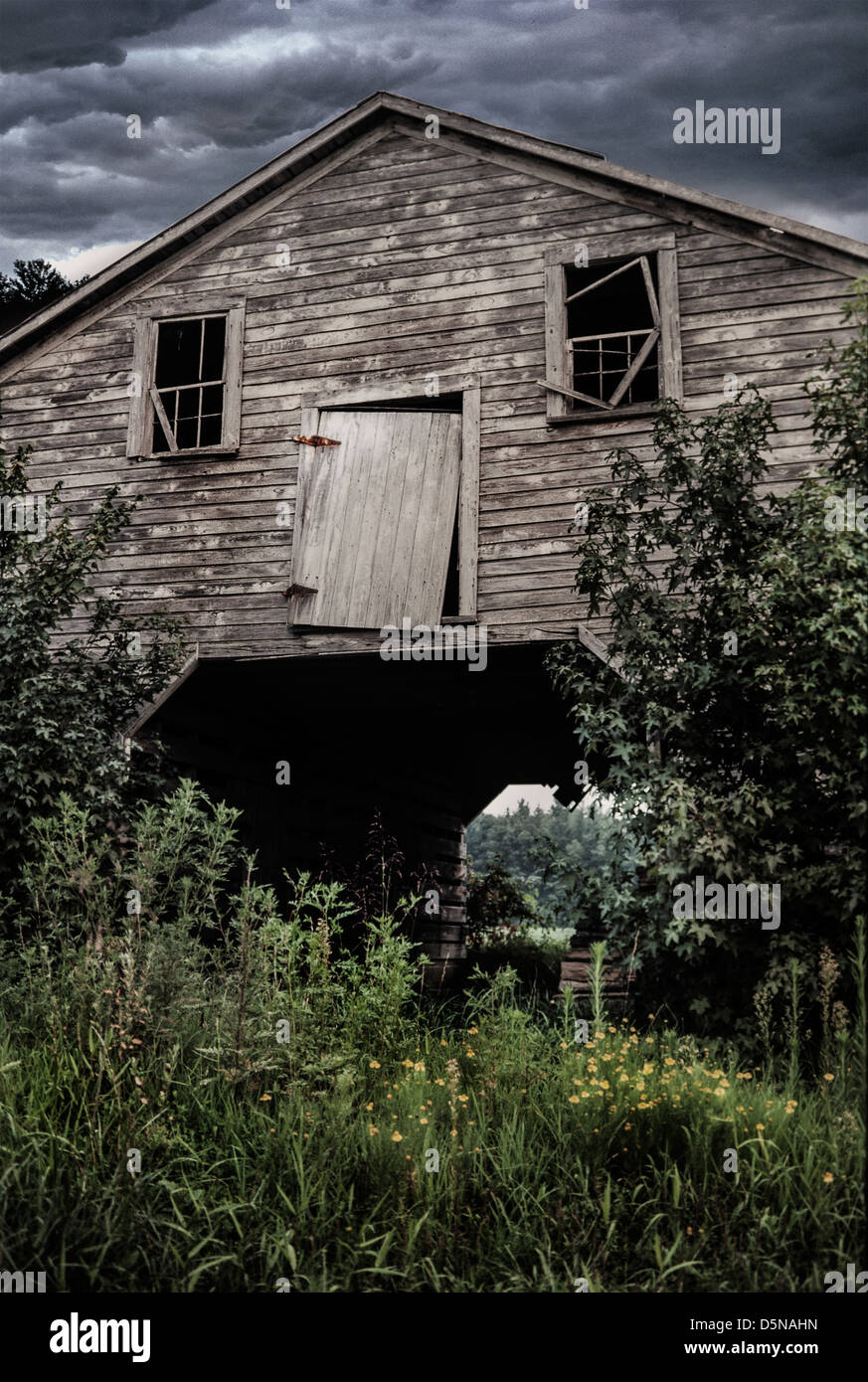 Dilapidated barn with storm clouds Stock Photo