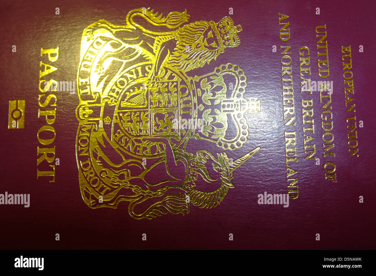 The front cover of a British passport photographed in a studio Stock
