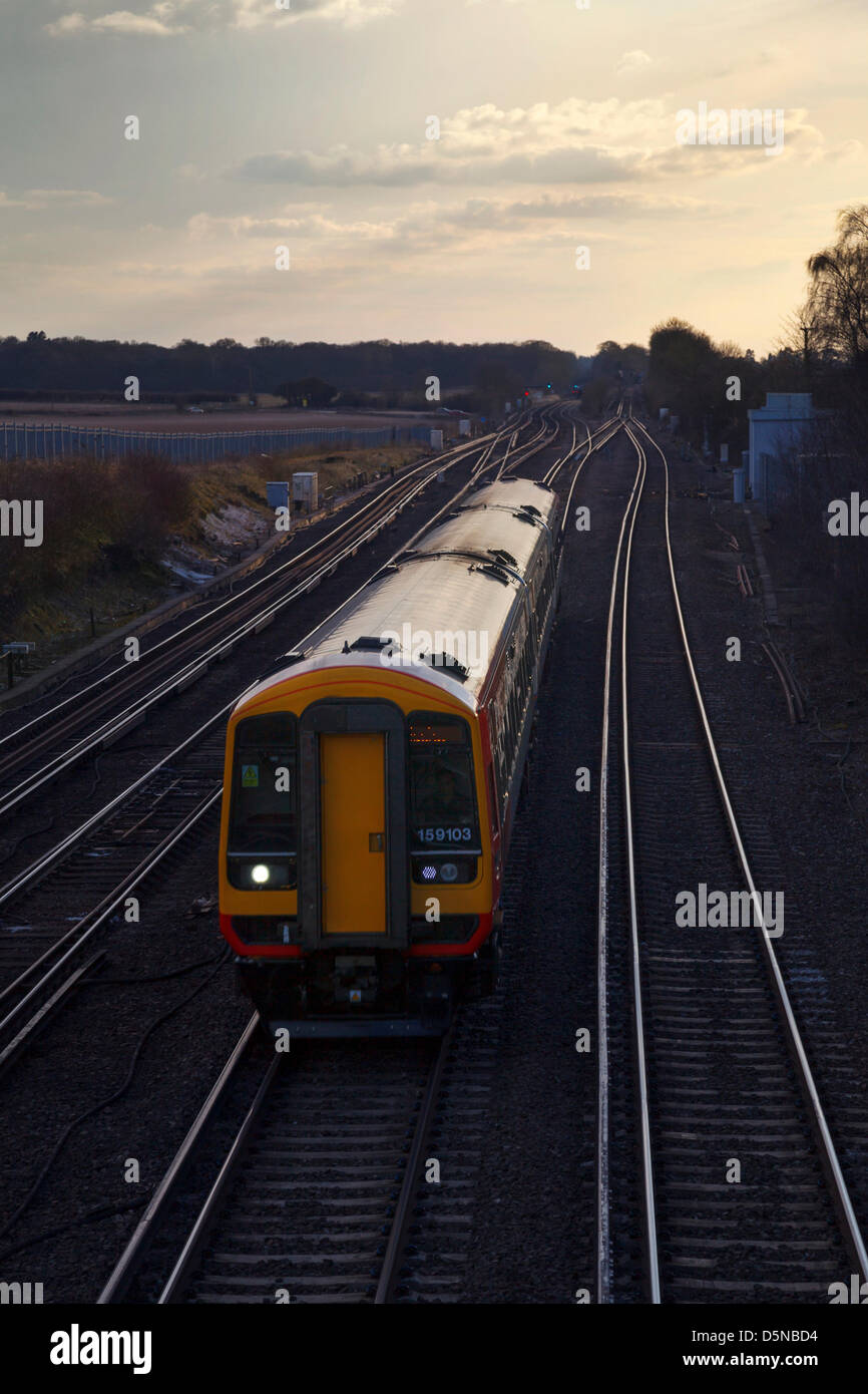 Worting, Hampshire, UK. 5th April 2013 A South West Trains evening commuter service from Salisbury passing Worting Junction in Hampshire, en-route to London Waterloo.  Credit: Rob Arnold/Alamy Live News Stock Photo