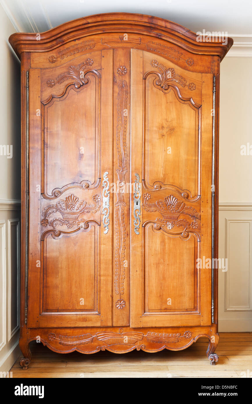 carved wooden doors of old retro wardrobe Stock Photo