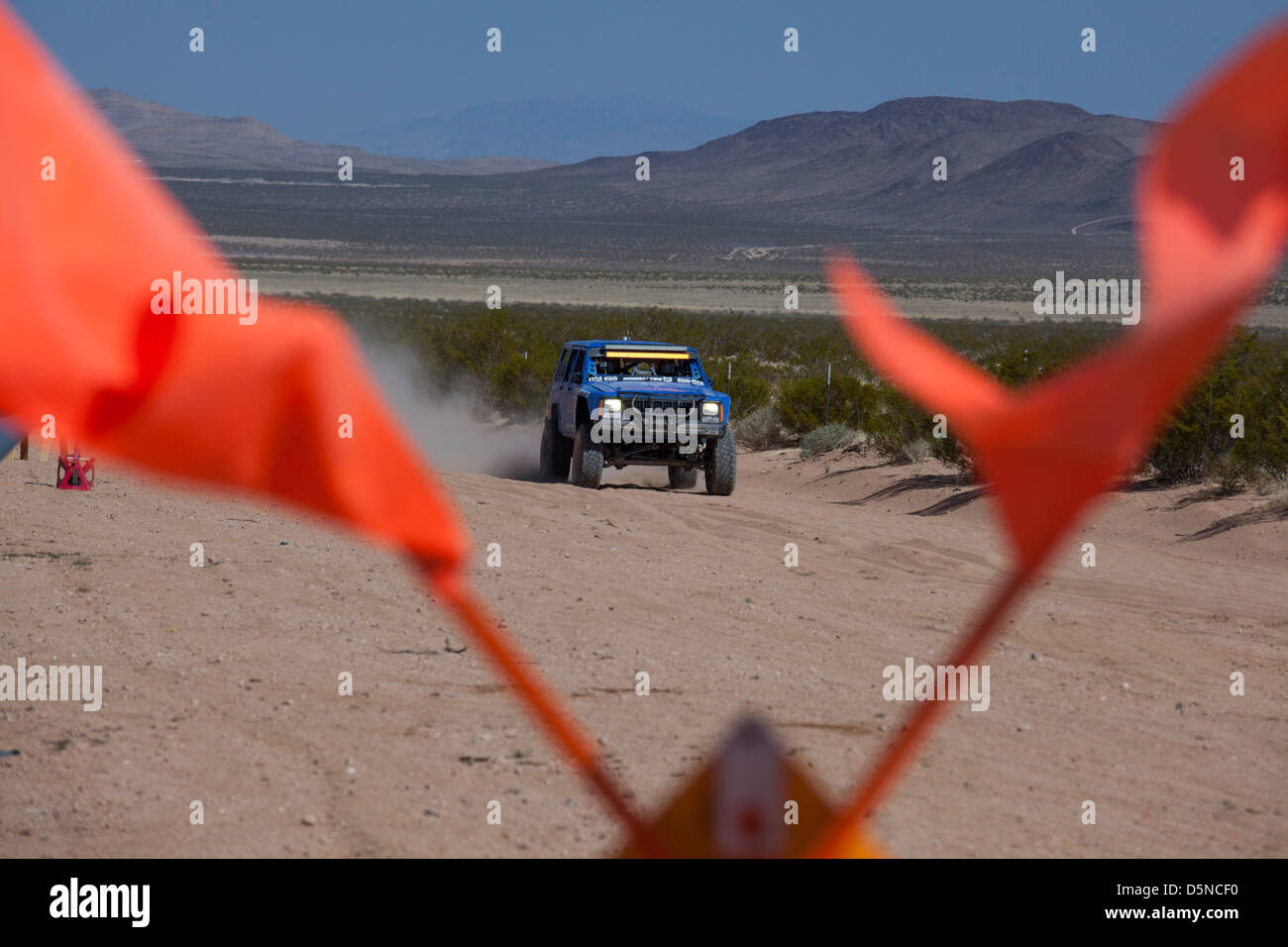 Jean, Nevada - The Mint 400 off-road auto race through the Mojave Desert near Las Vegas. Flags mark a pit stop. Stock Photo