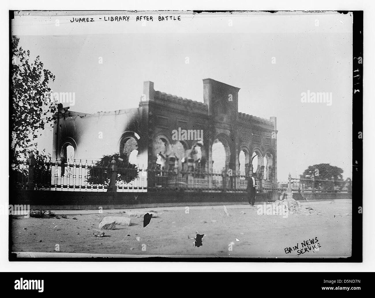 This image depicts the aftermath of a battle at the library in Ciudad Juarez, Mexico, during the Mexican Revolution, showcasing the damage inflicted by fire and war during the conflict of the 1910s. Stock Photo