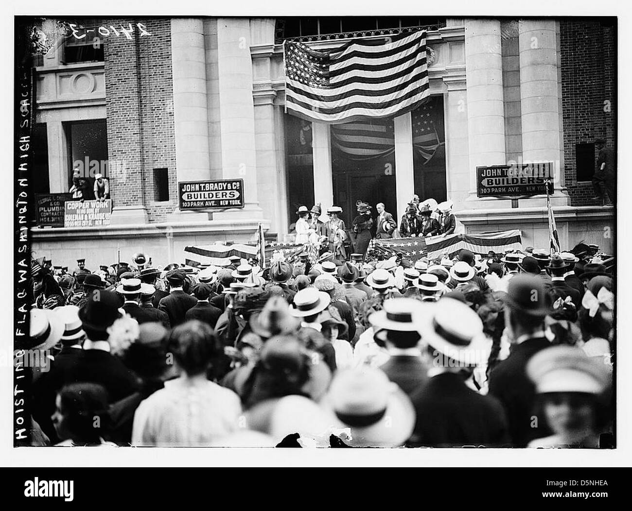 Hoisting flag - Wash. High School (LOC) Stock Photo