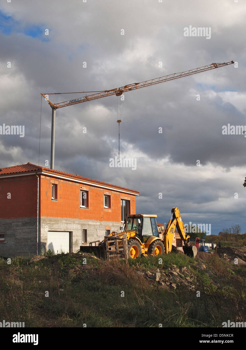 Low angle shot of a construction crane captured on a cloudy Stock Photo ...