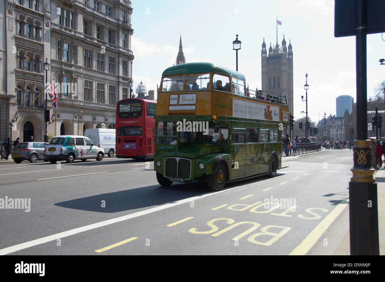 Harrods Double-Decker sightseeing Tour Bus in London (with Big Ben in the background). Stock Photo