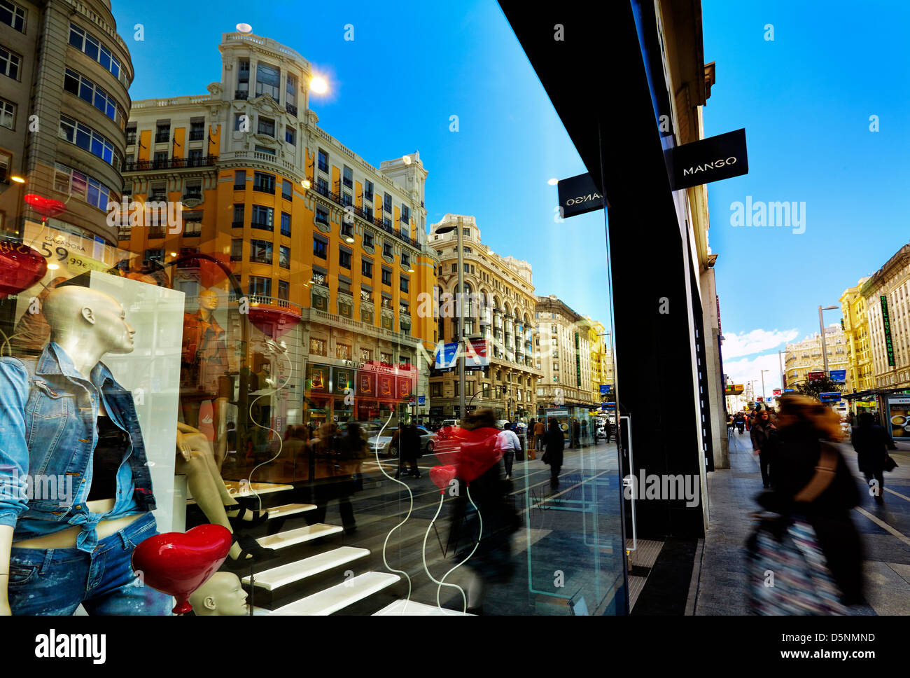 Mannequins and reflections at a window shop in Gran Via avenue. Madrid. Spain Stock Photo