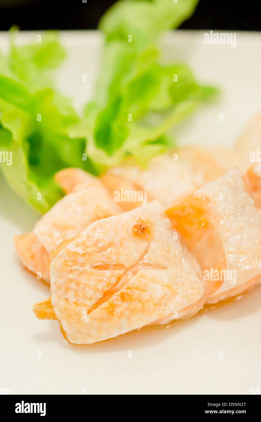 Grilled salmon belly served with fresh lettuce Stock Photo Alamy