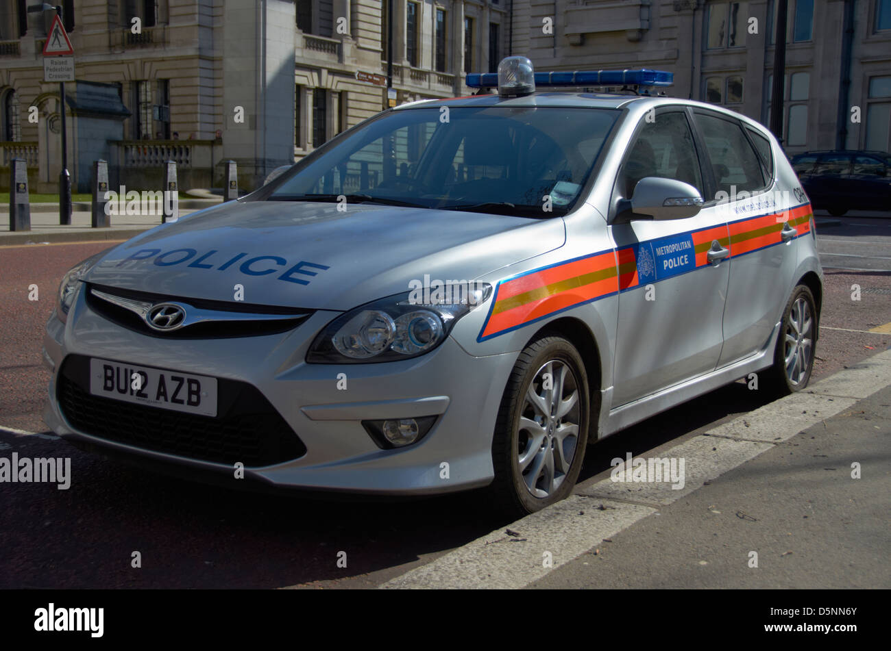 Silver police car parked on Horse Guards Road, London (next to St James Park). Stock Photo