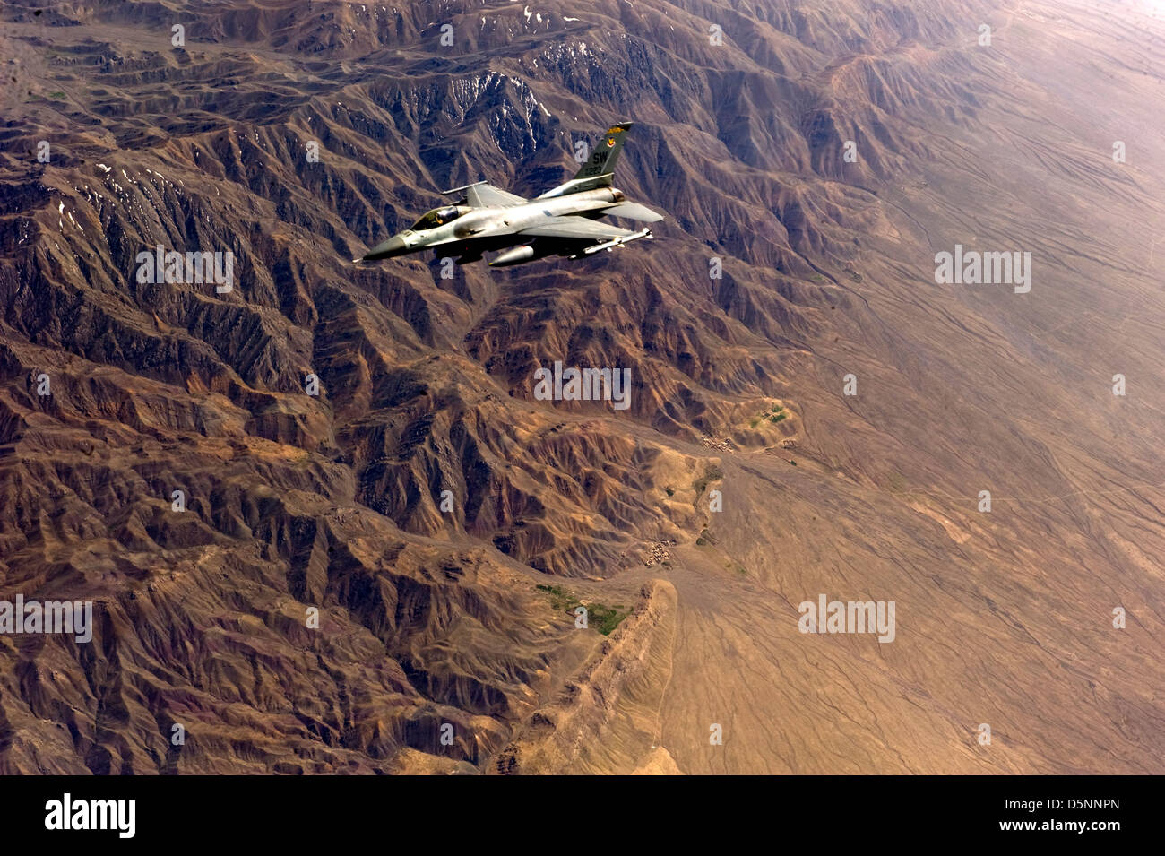 A US Air Force F-15E Strike Eagle resumes combat operations after refueling April 1, 2013 over Afghanistan. Stock Photo