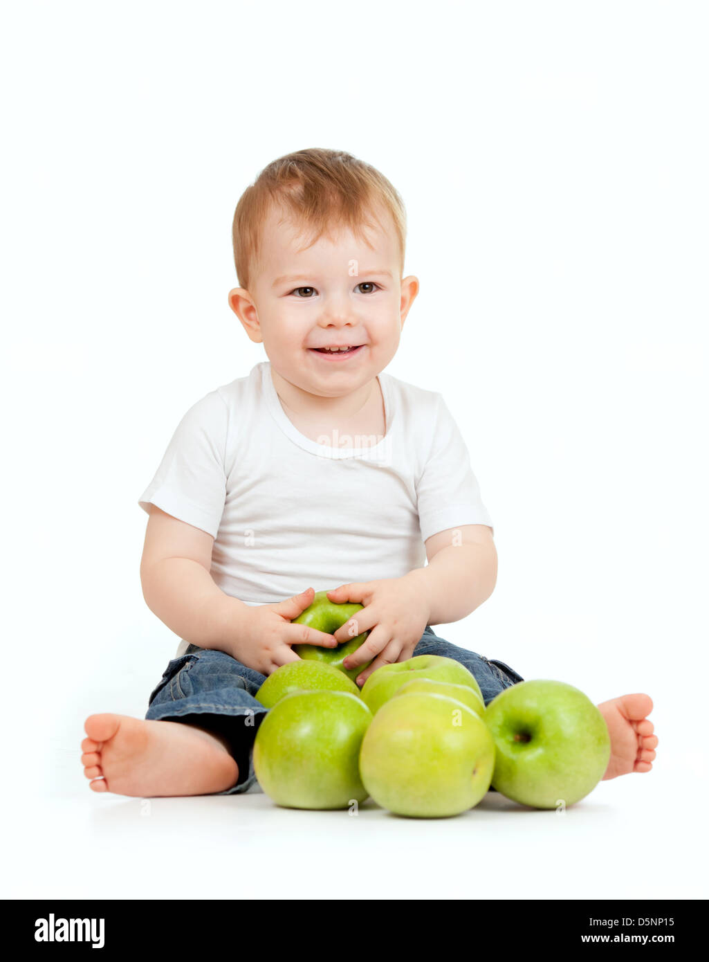 Adorable child with green apples Stock Photo Alamy