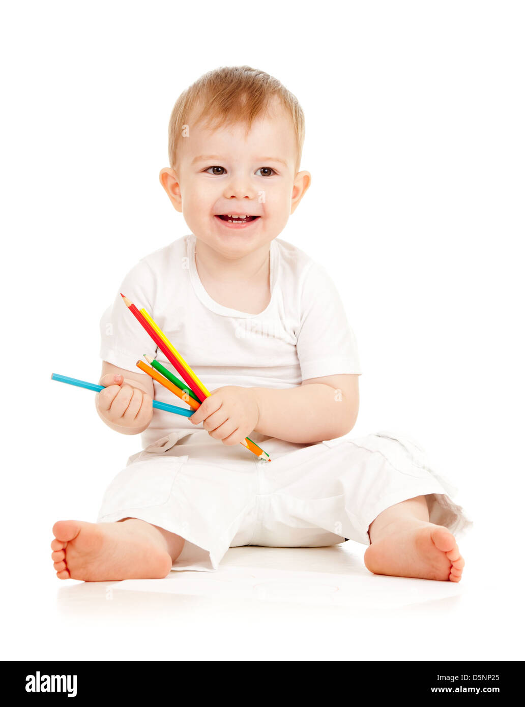 funny baby boy drawing with color pencils Stock Photo
