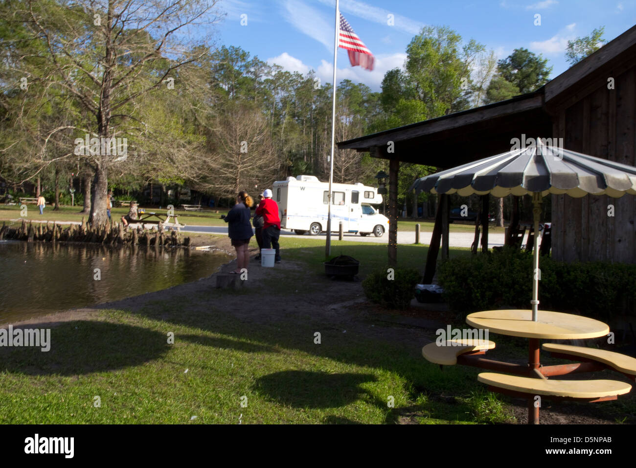 Ernie's Bass Pond, with its bald cypress island, offers free fishing to the public at Highland