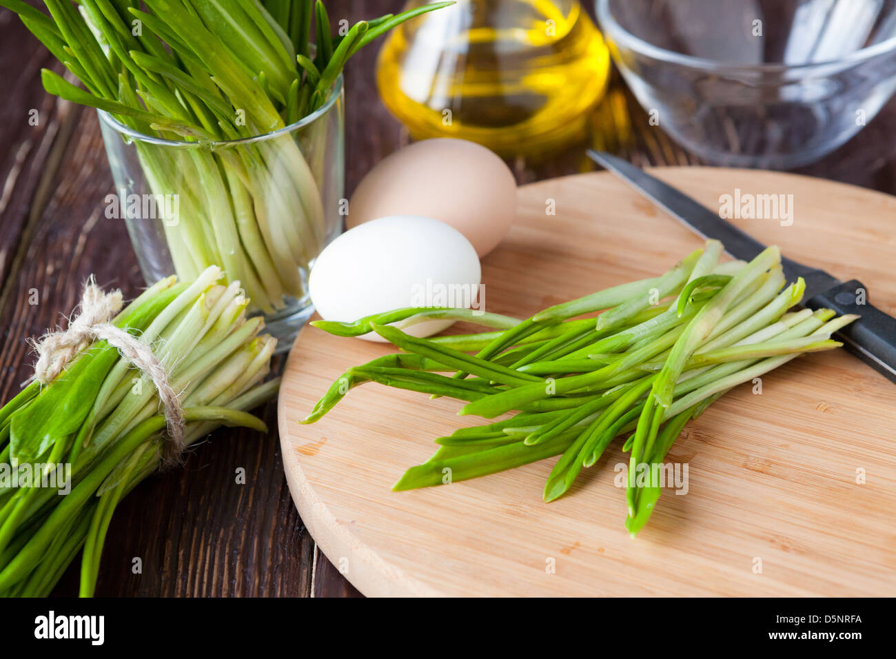 bunch of spring ramson on a board, greens Stock Photo