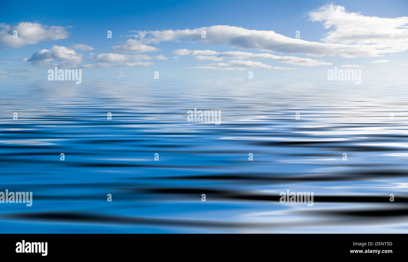 Blue sky with fluffy clouds and water reflection Stock Photo - Alamy