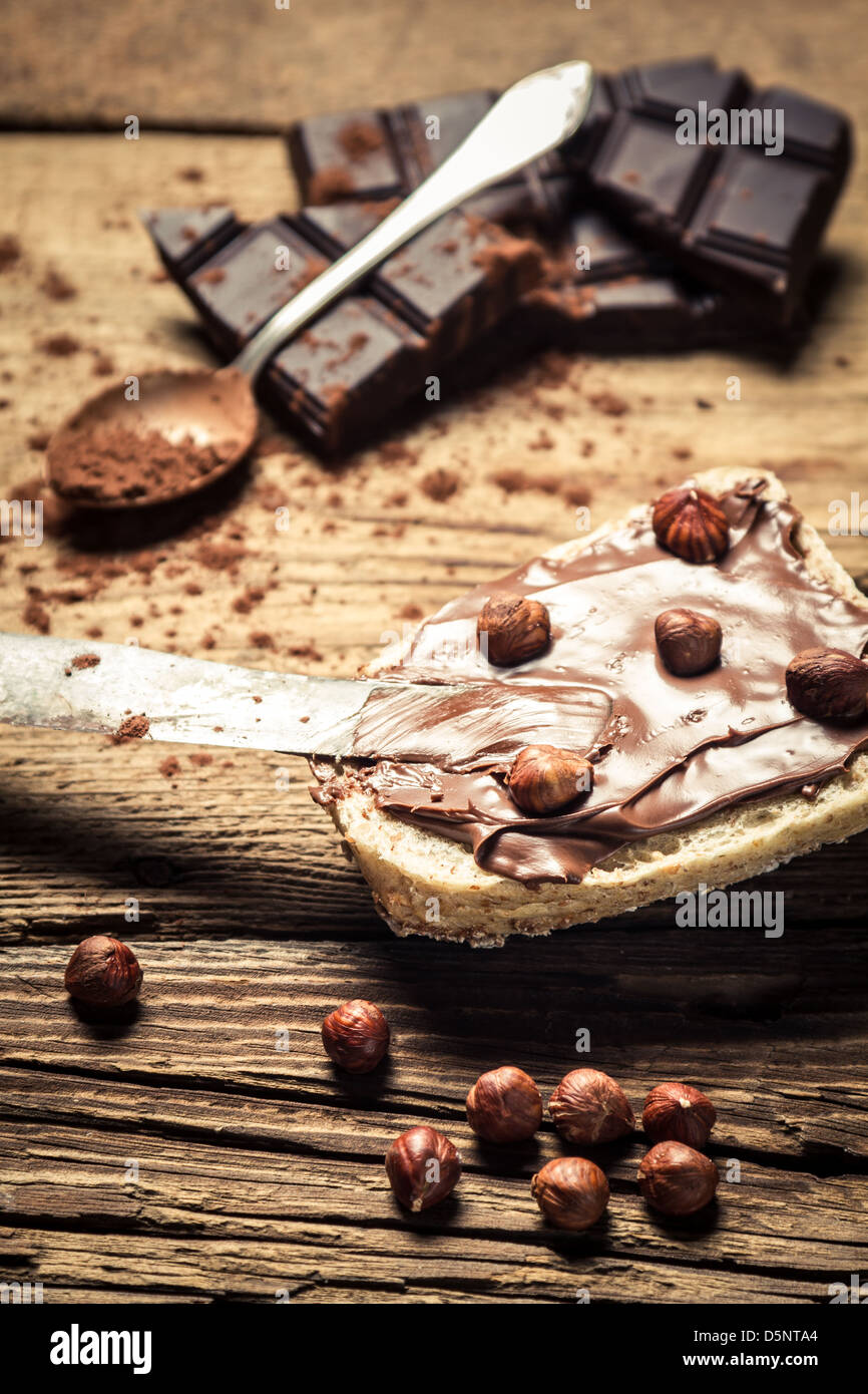 Bread spread with chocolate butter Stock Photo