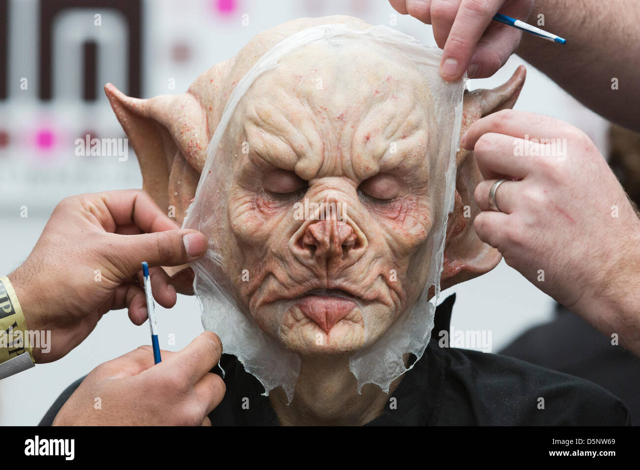 London, UK. 6th April 2013. Picture: Paul Warren, 38, creature performer receives a special effects makeover. UMA 2013, United Makeup Artists Expo takes place at the Business Design Centre in Islington, North London. At this European event created by Chris McGowan, leading professionals provide demonstrations and the latest techniques and products are showcased. Photo: Nick Savage/Alamy Live News Stock Photo