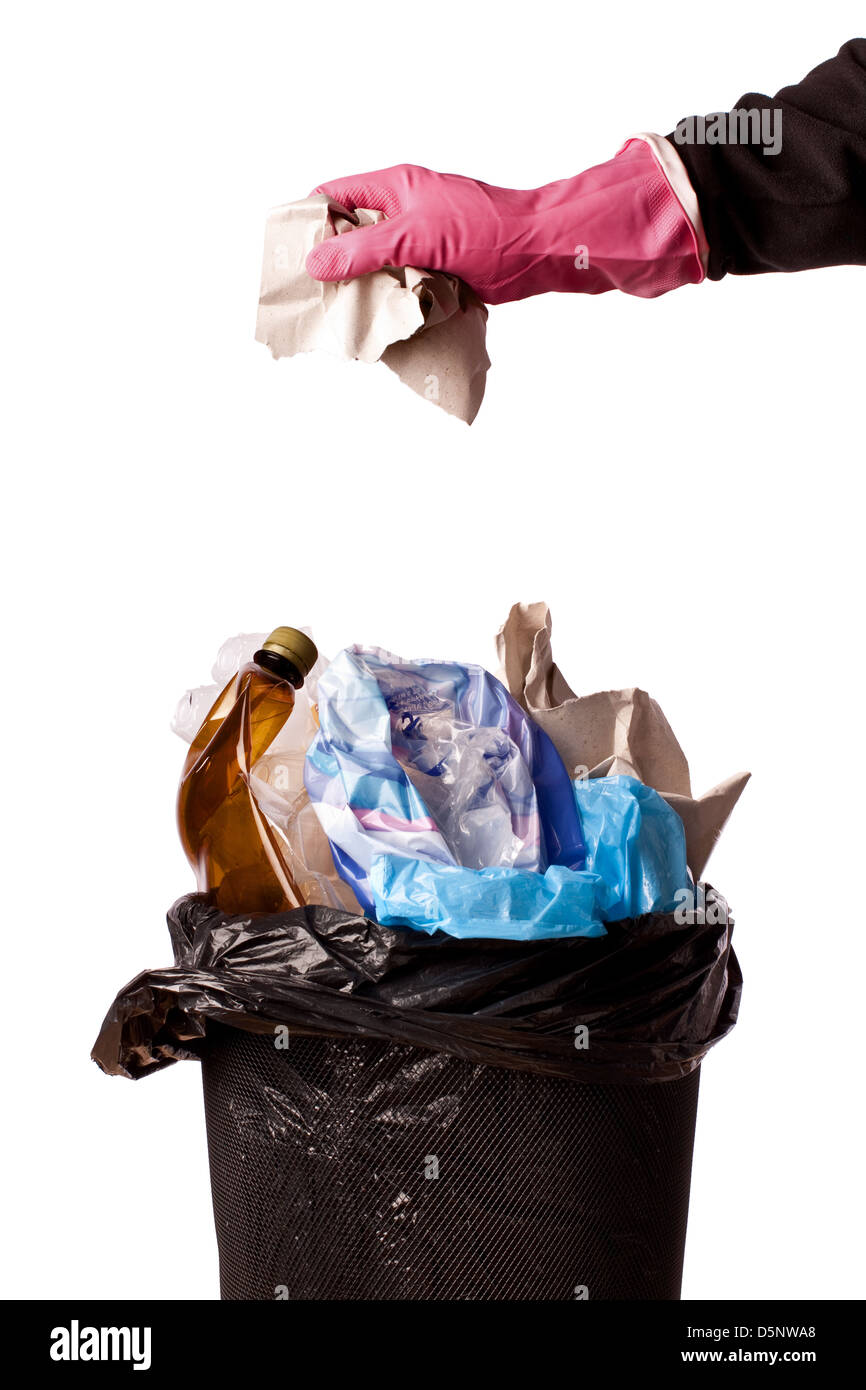 hand throwing rubbish in a trash bin Stock Photo