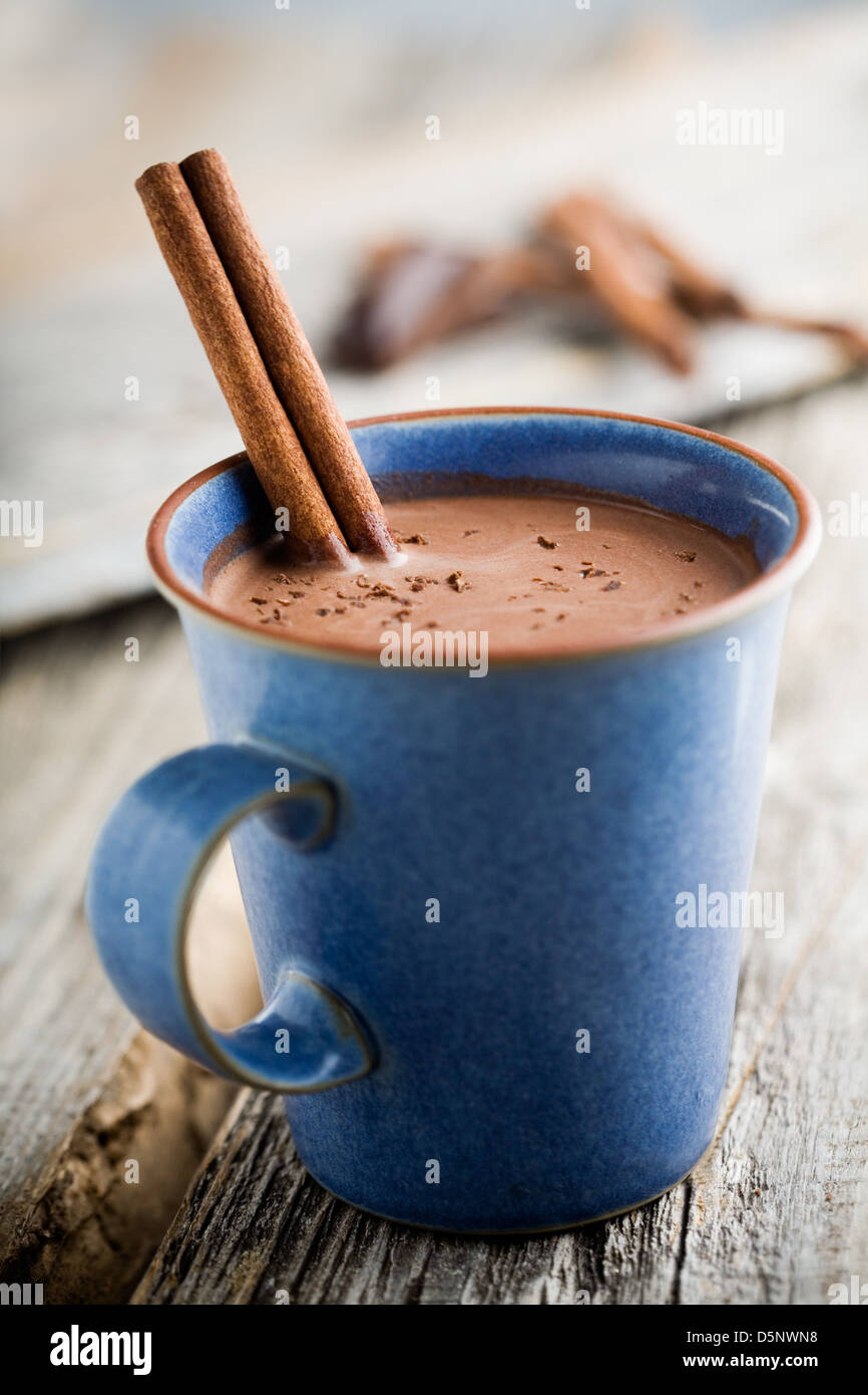 Hot chocolate with cinnamon stick as spoon Stock Photo Alamy
