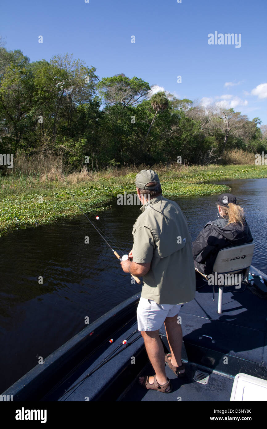 Highland Park Fish Camp owner Ron Rawlins casts for largemouth bass on the backwaters of the St. Johns River near Deland, FL Stock Photo
