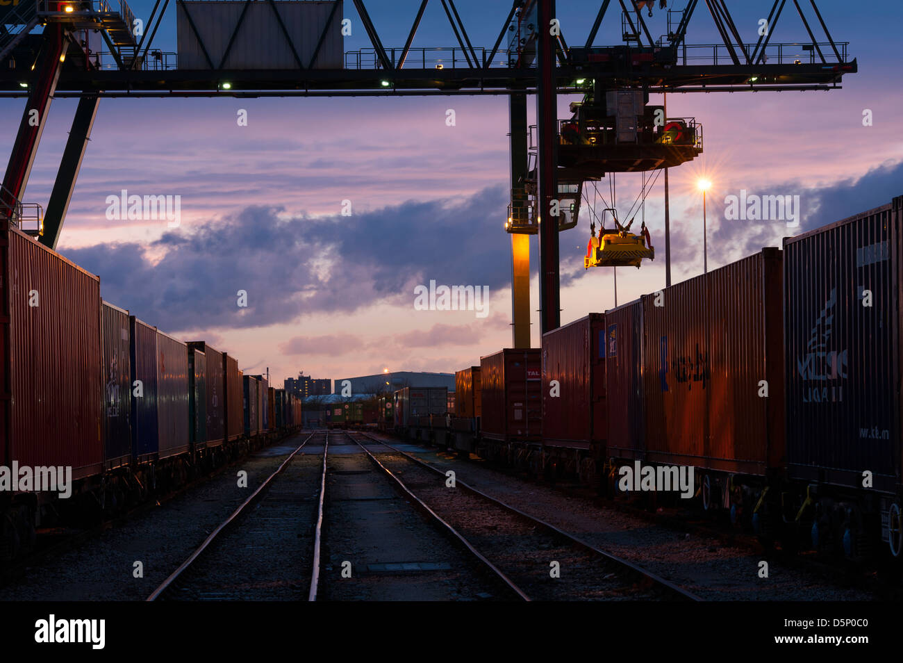 Beautiful view of cranes at Manchester Freightliner railway freight terminal at dusk. Stock Photo