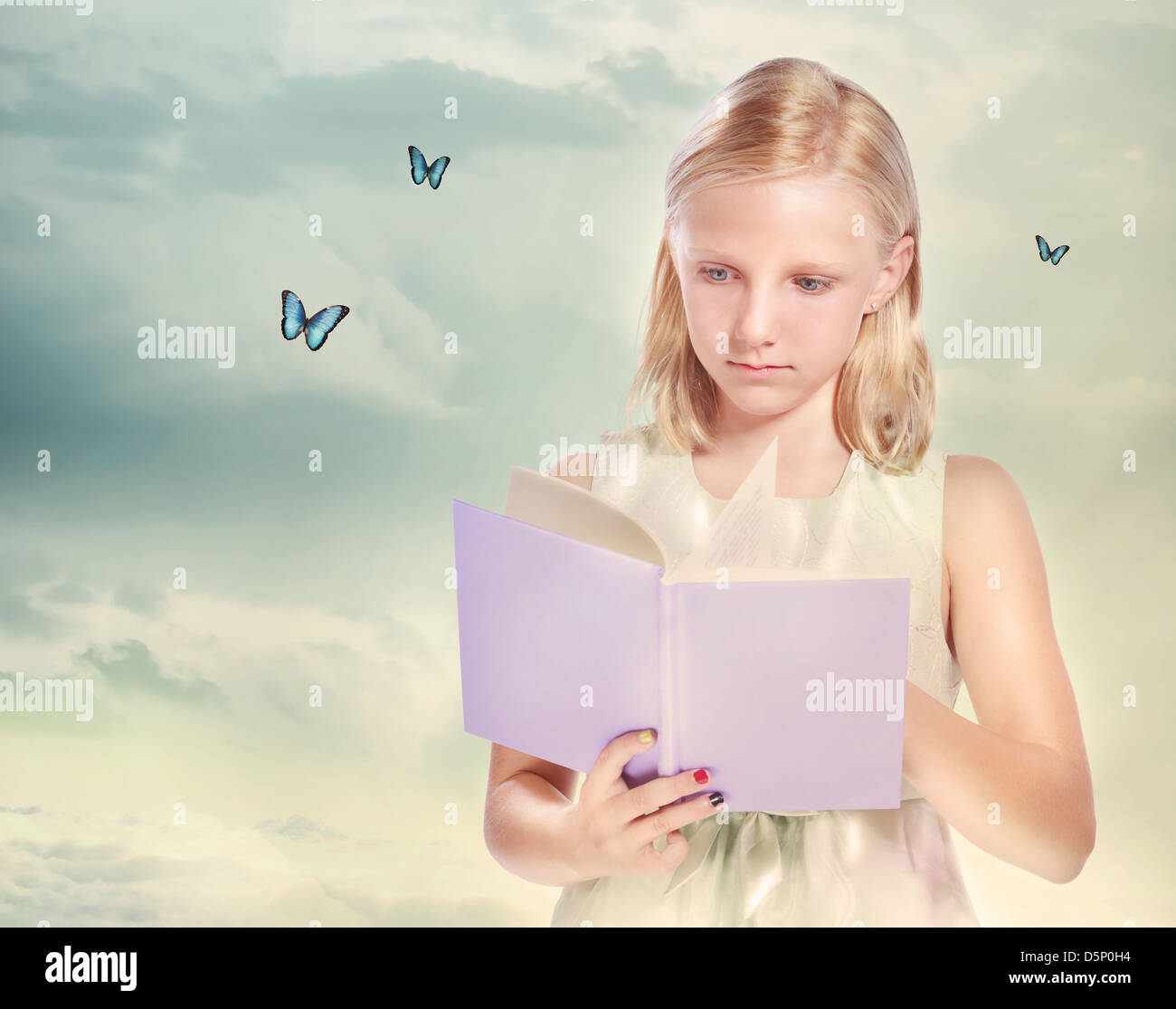 Little Blond Girl Reading a Book with Butterflies Stock Photo