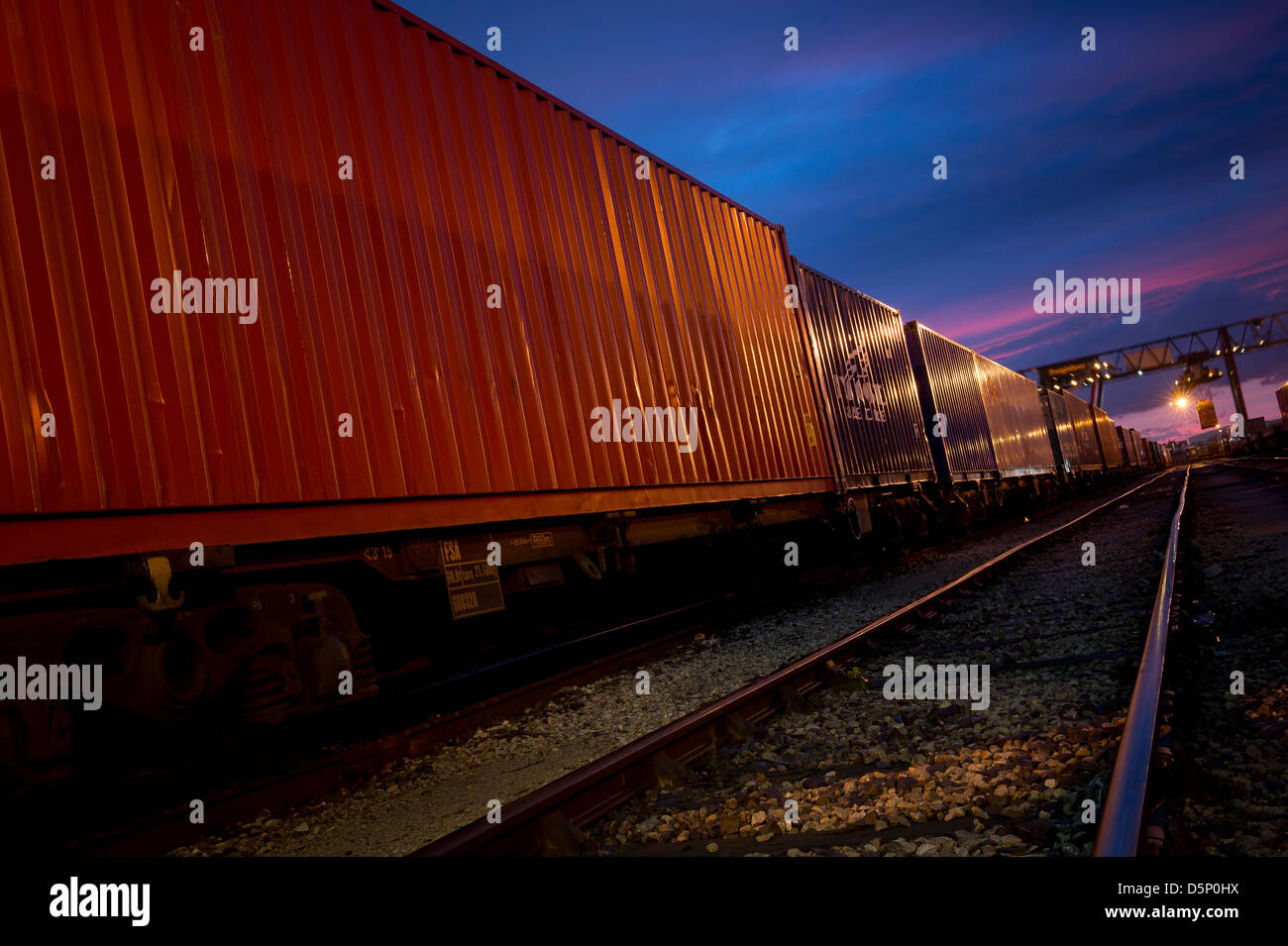 Beautiful view of freight train waiting at Manchester Freightliner railway freight terminal at dusk. Stock Photo