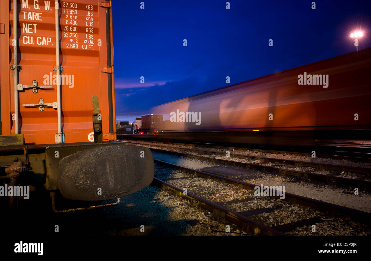 Beautiful view of freight trains waiting at Manchester Freightliner railway freight terminal at dusk. Stock Photo