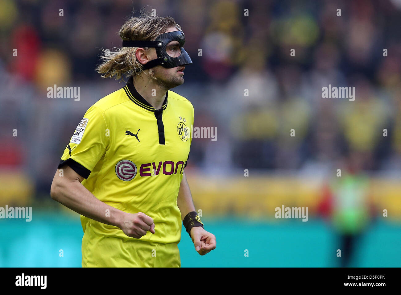 Dortmund's Marcel Schmelzer wears a mask to protect his broken nose during  the Bundesliga soccer match between Borussia Dortmund and FC Augsburg at  Iduna Park in Dortmund, Germany, 06 April 2013. Photo: KEVIN