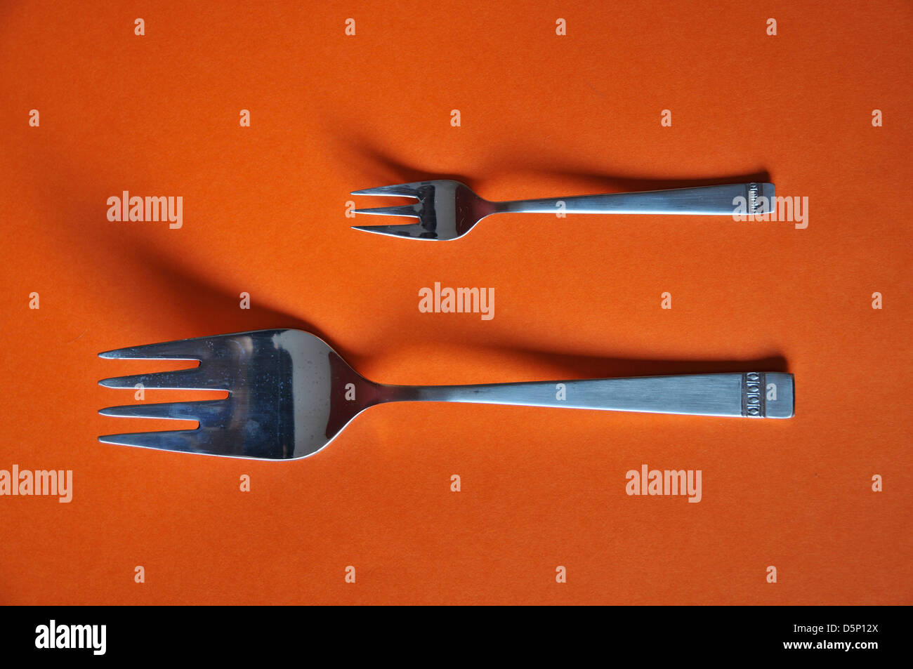 small and large fork Stock Photo Alamy