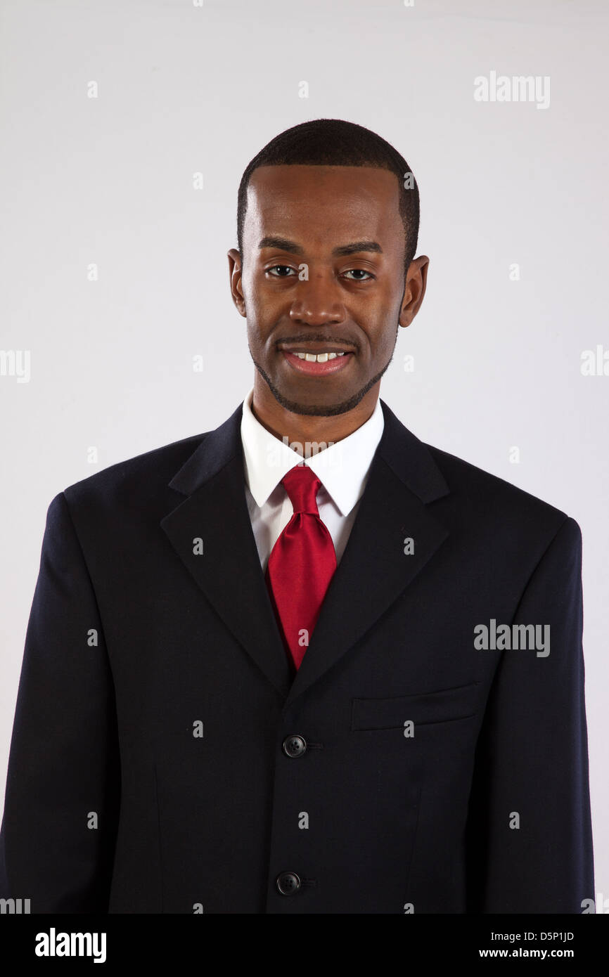 Happy black man in a blue plaid shirt, looking at the camera with a friendly, pleased smile Stock Photo