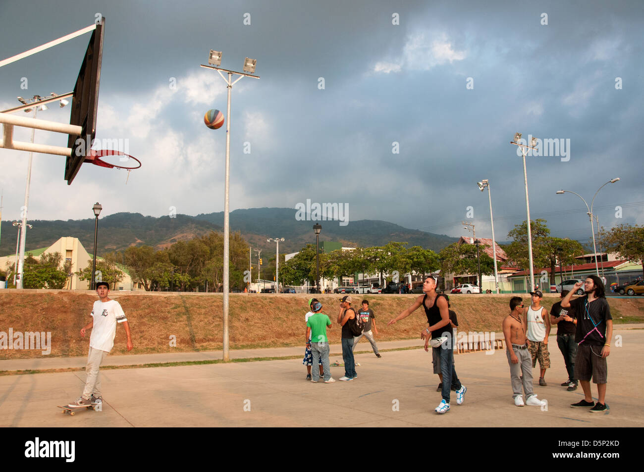 Youth playing basket ball in Ciudad Colon a small town located in the Central Valley Costa Rica Stock Photo