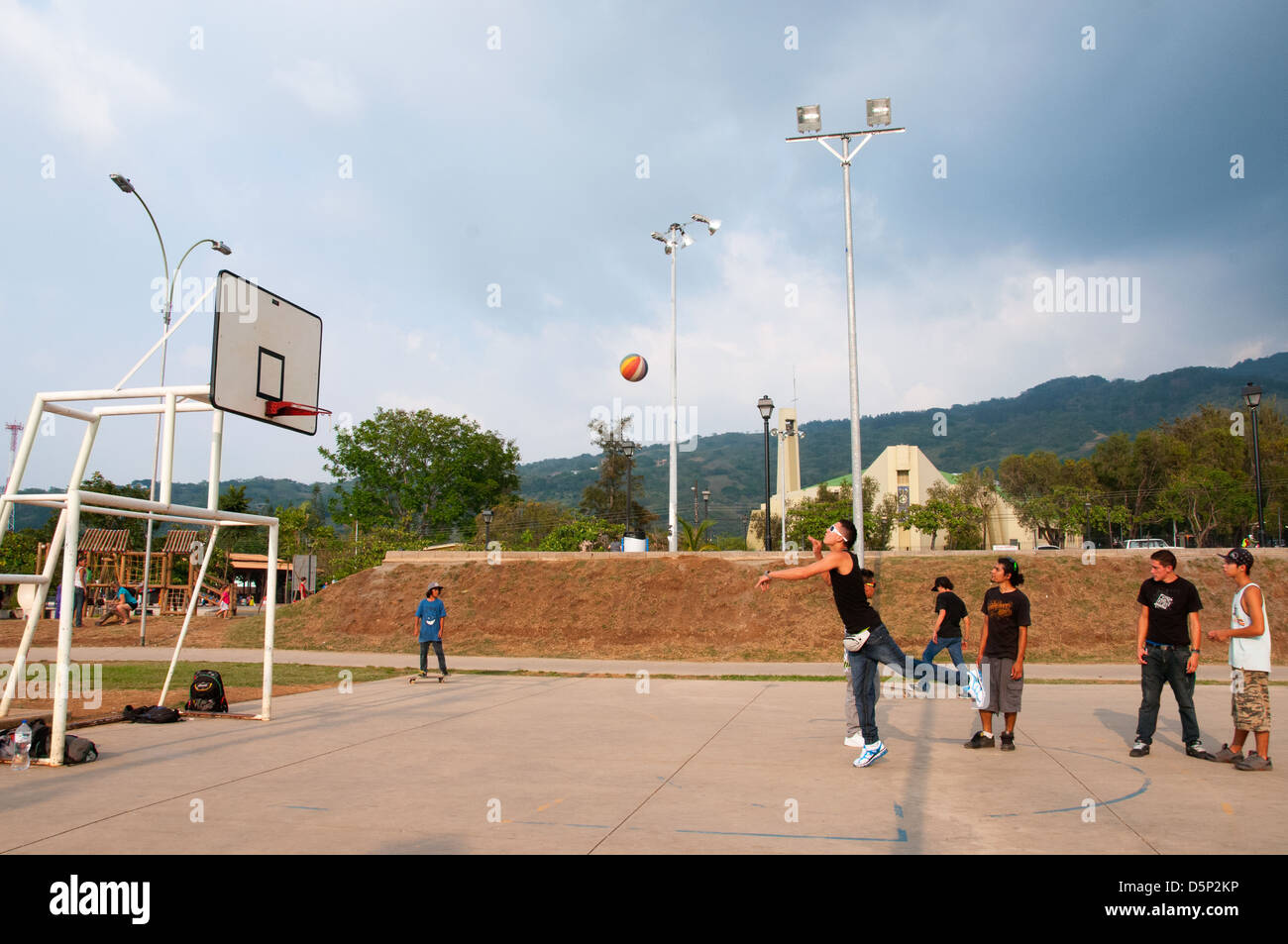 Youth playing basket ball in Ciudad Colon a small town located in the Central Valley Costa Rica Stock Photo