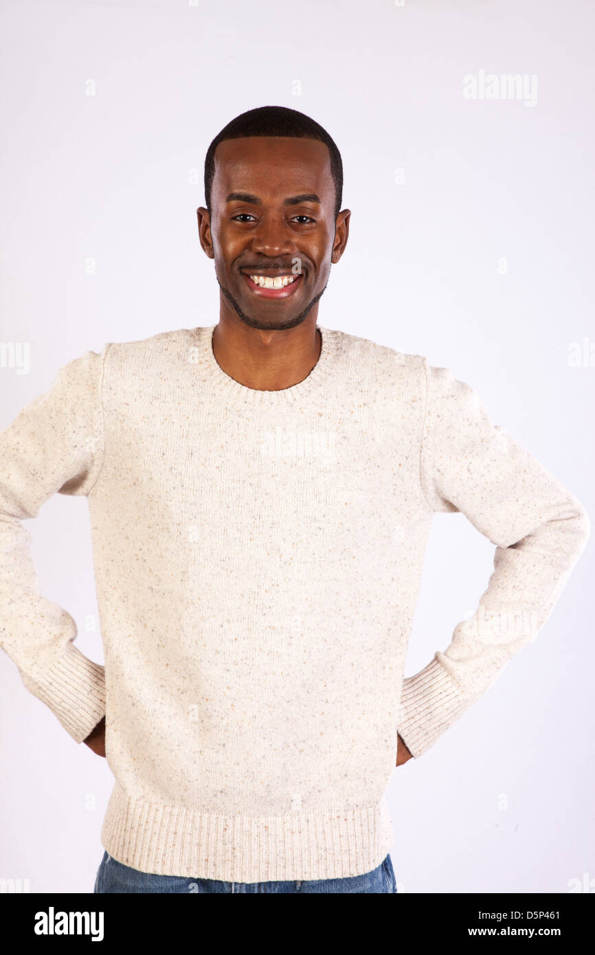 Handsome black man wearing a white pull over sweater,  looking at the camera  with a happy smile Stock Photo