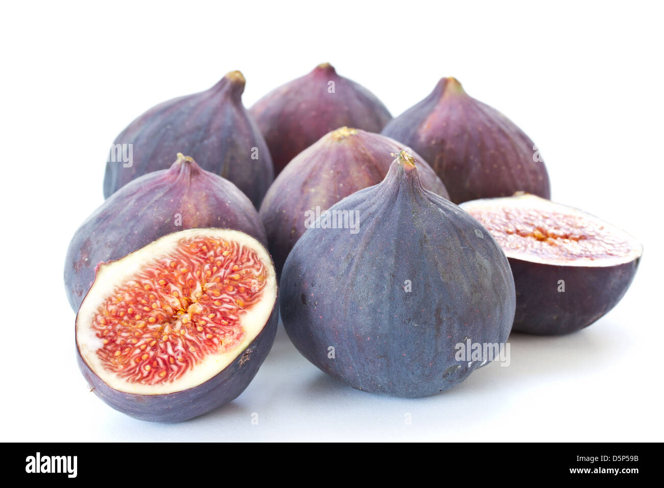 3 Ripe Figs ripe figs cut in on a white background Stock Photo - Alamy