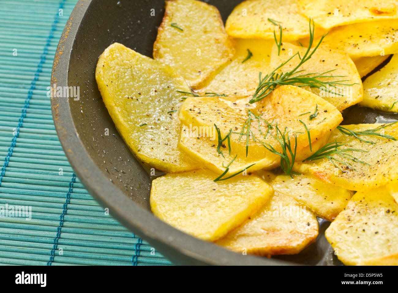 hot roast potatoes with dill and black pepper Stock Photo Alamy