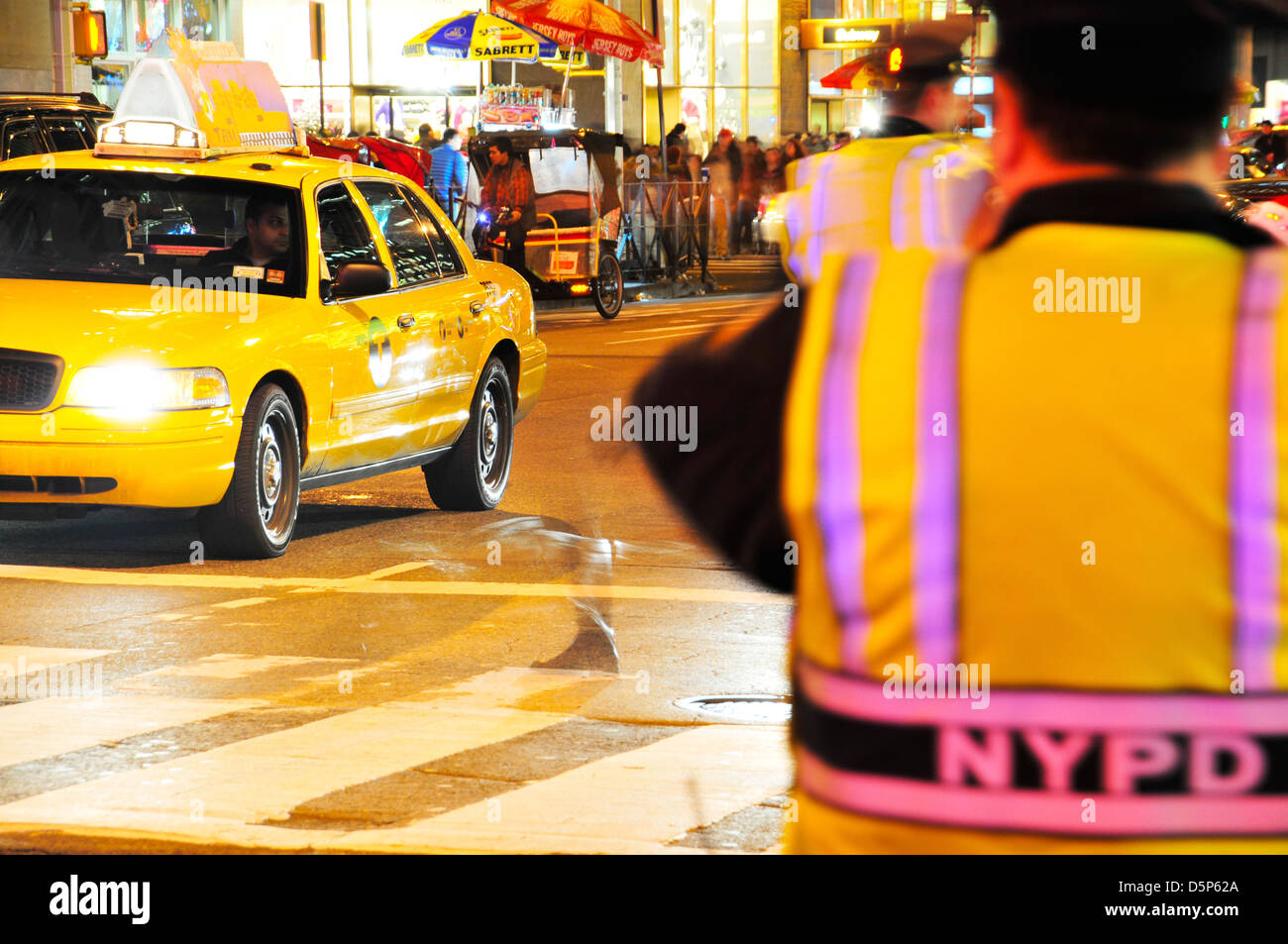 Vehicular traffic on Avenue of the Americas near Radio City Music Hall and Rockefeller Center... Stock Photo