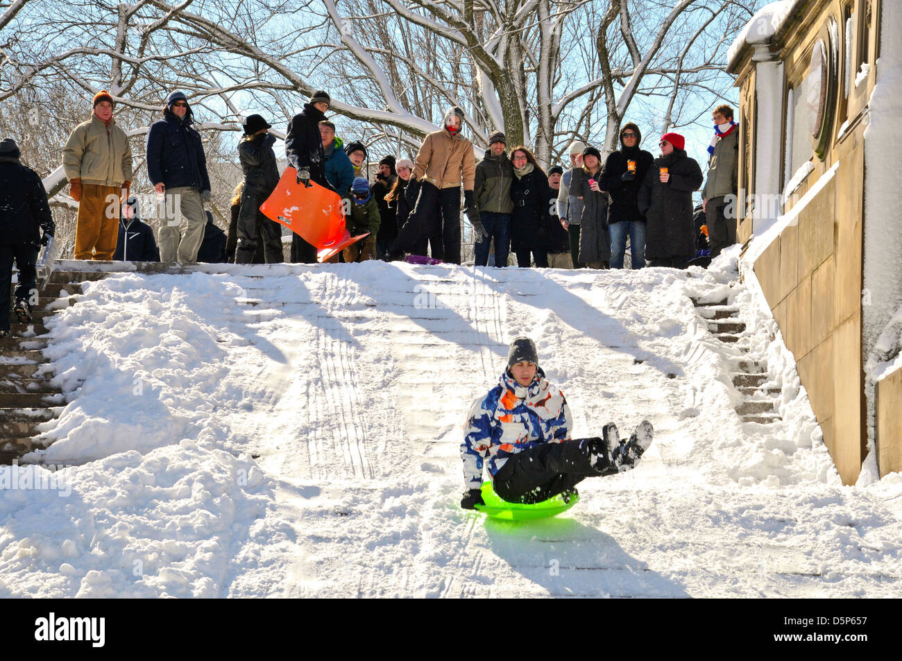 People sledding during winter storm in Central Park, New York City