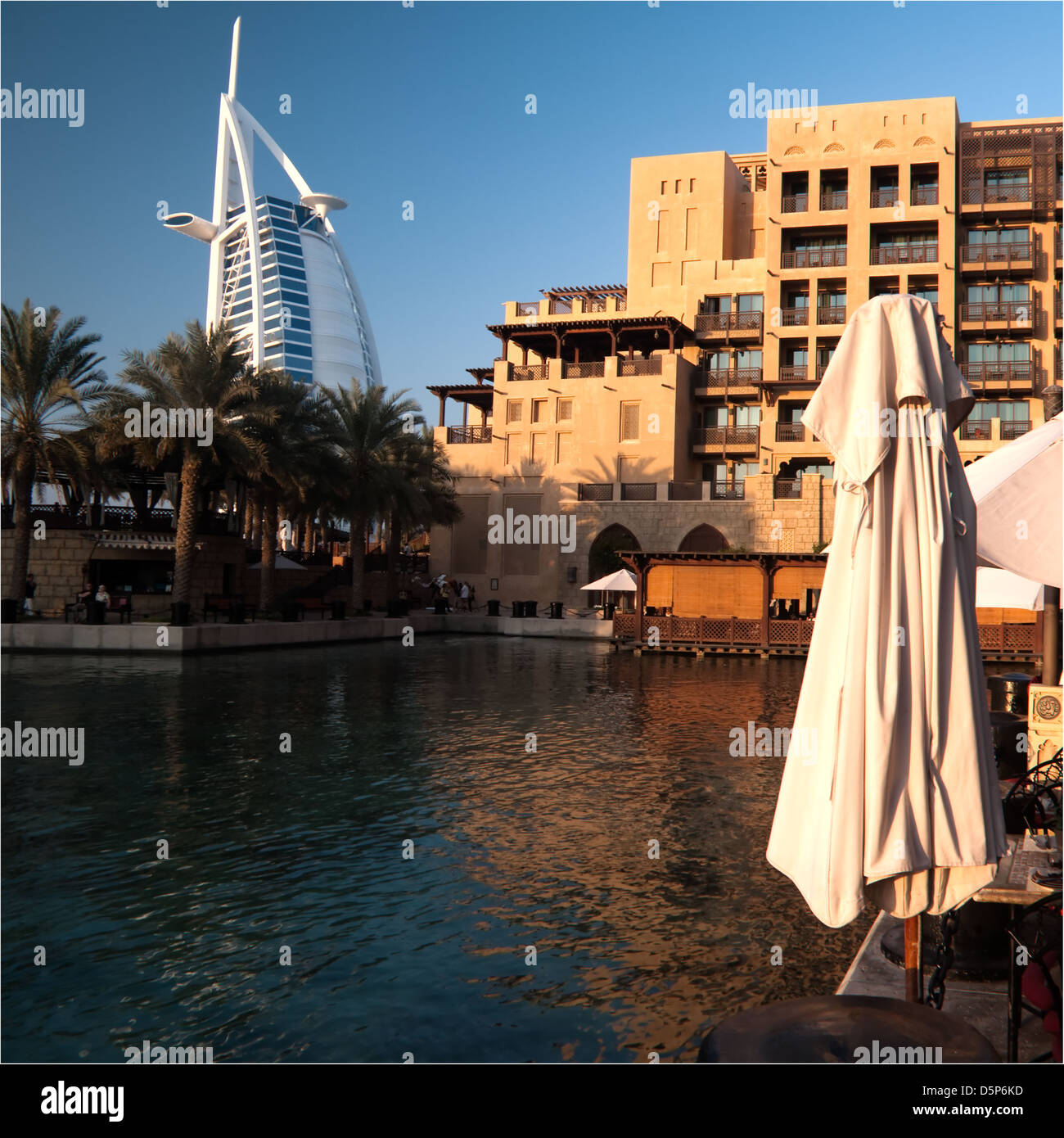 Architecture contrast in DUbai: Madinat Jumeirah Hotel classic with the modern Burj Al Hotel in the background, Square format, Stock Photo