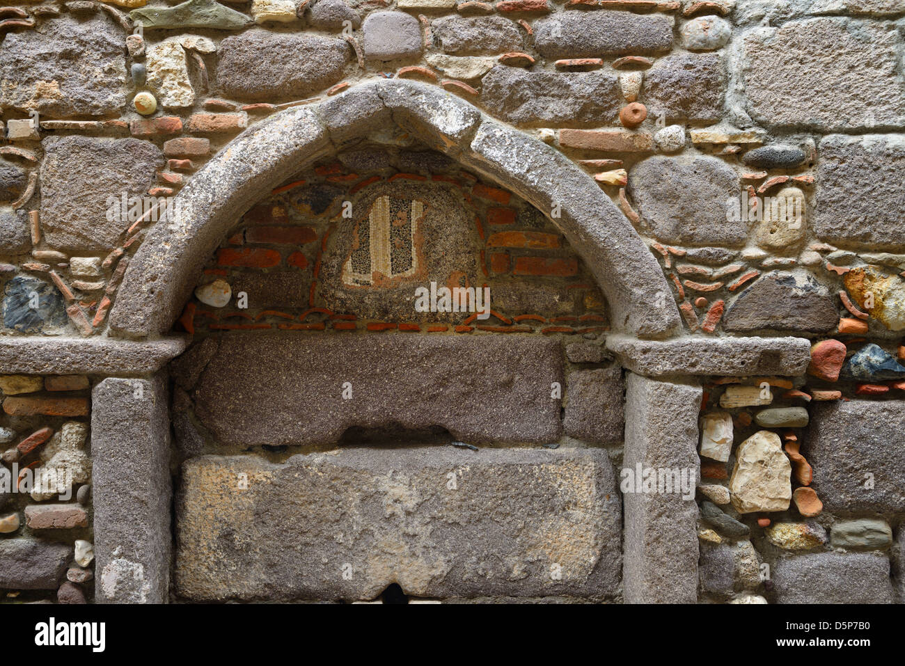 Elaborate stonework in wall at hamlet village of Assos Iskele Turkey Stock Photo
