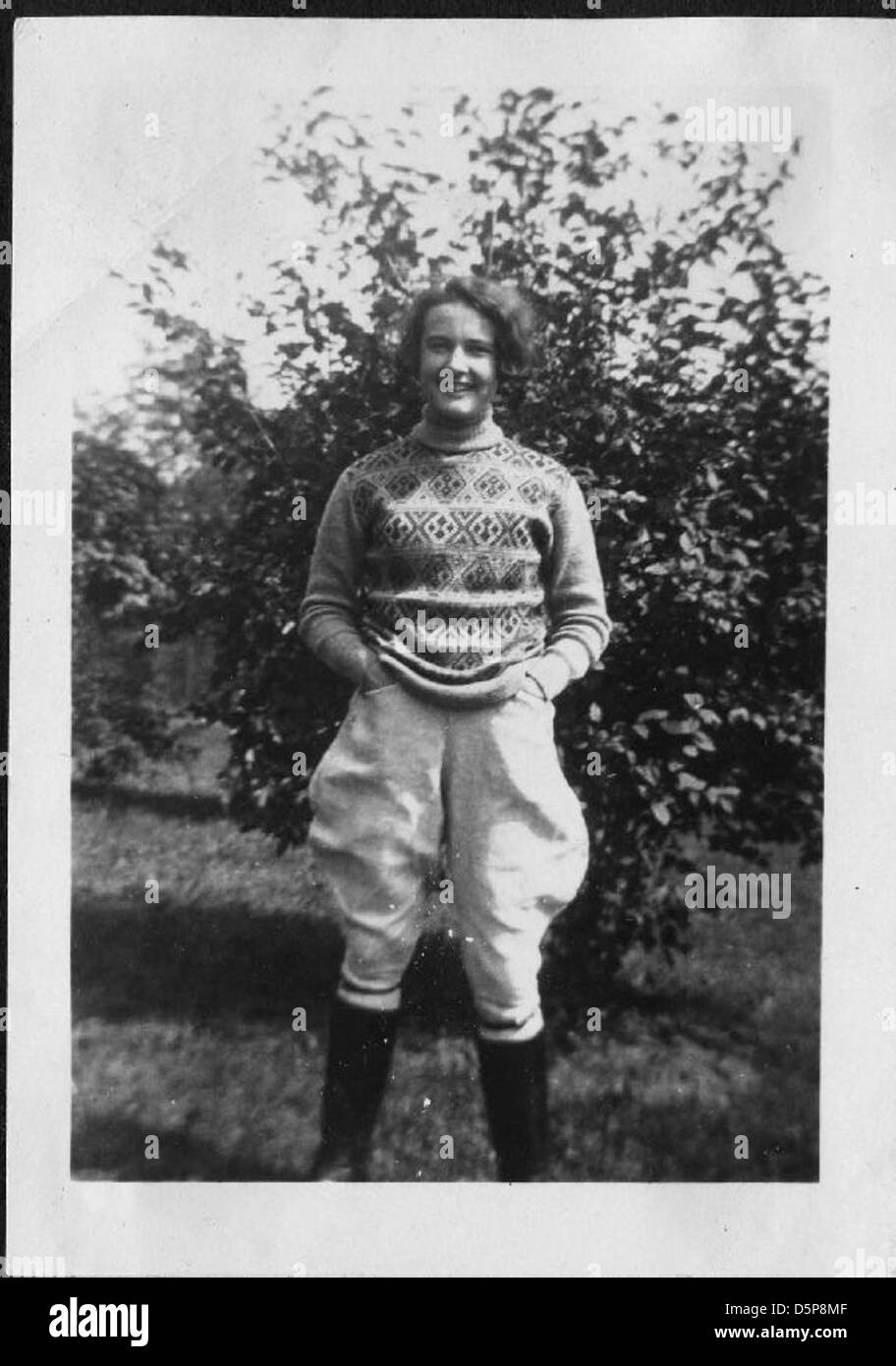 Helen Richey, a pioneering aviator, is seen outdoors in boots, jodhpurs ...