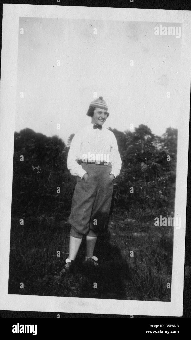 This image features Helen Richey, a pioneering female aviator, standing ...