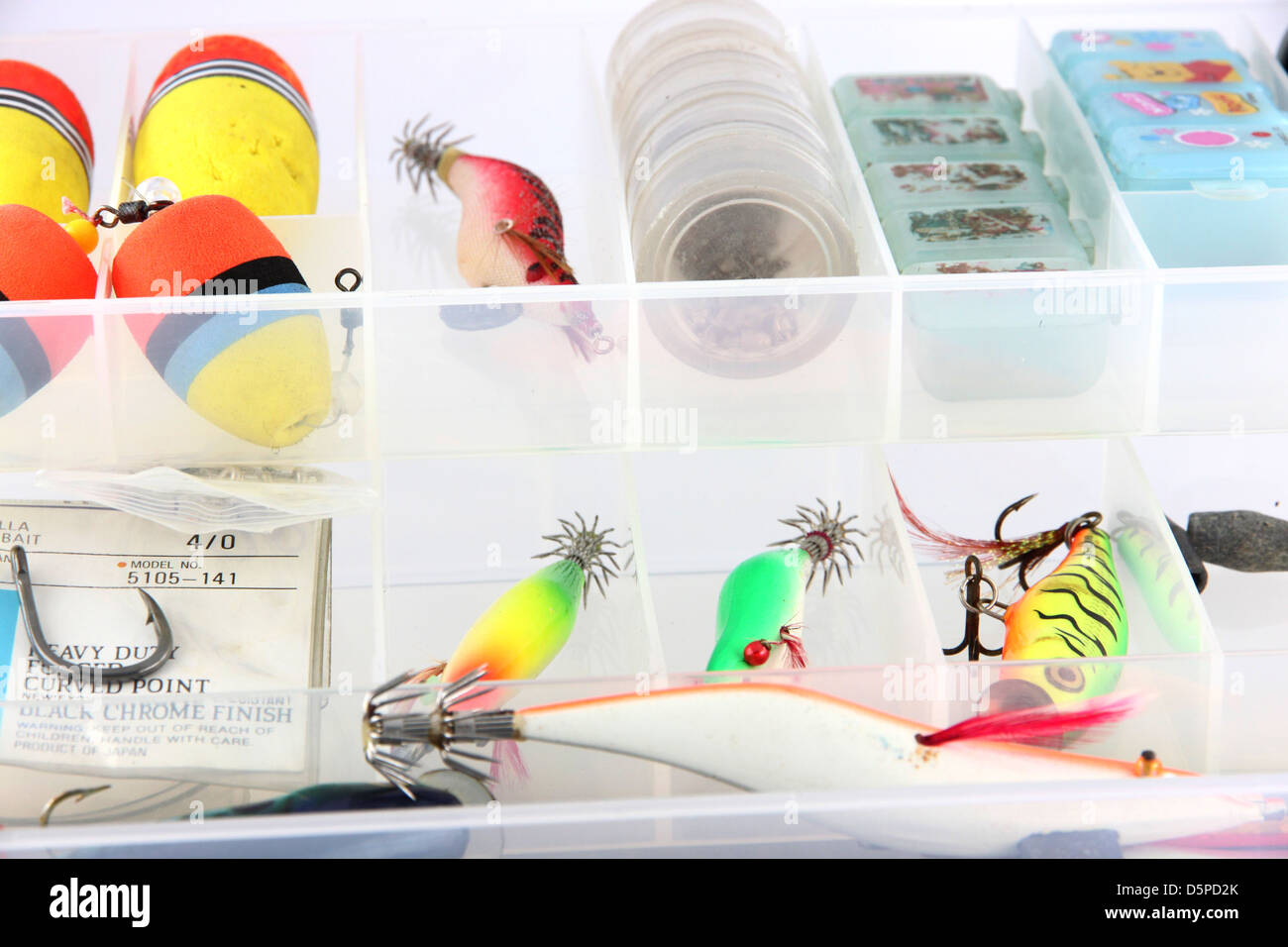 The Fishing accessories in the white box. Stock Photo