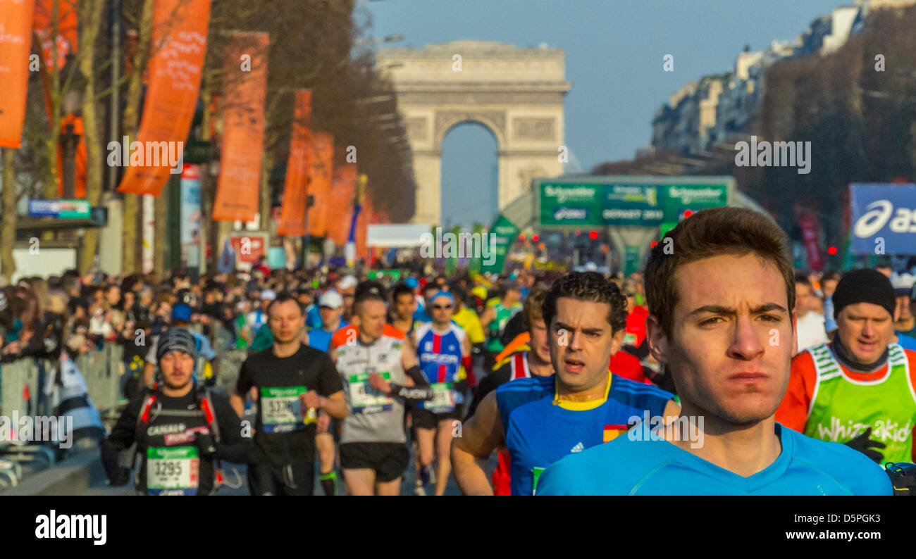 Paris, France .Crowd Runners taking part in the Paris marathon on Avenue de ChampsElysees, with
