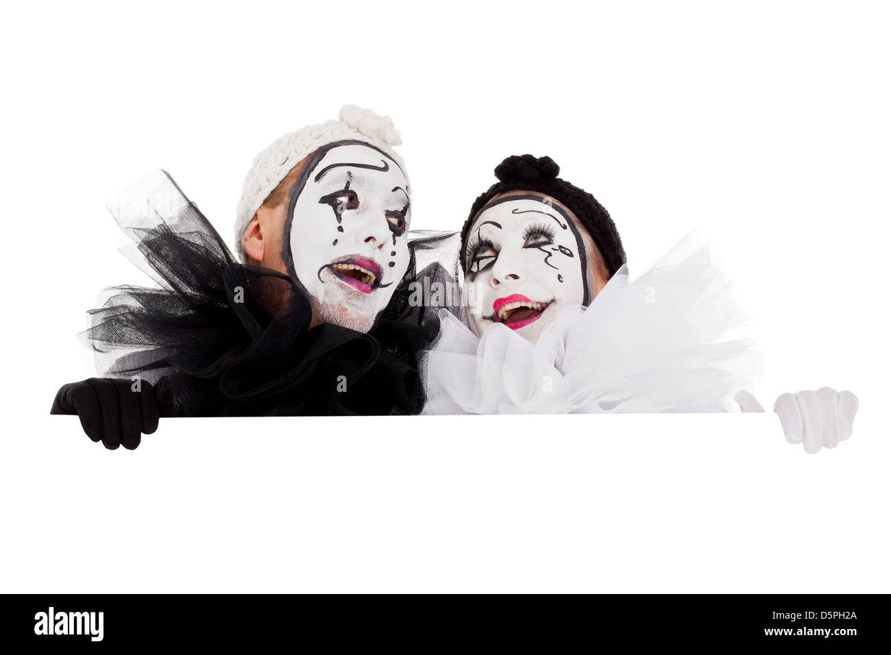 two funny clowns are looking impressed Stock Photo