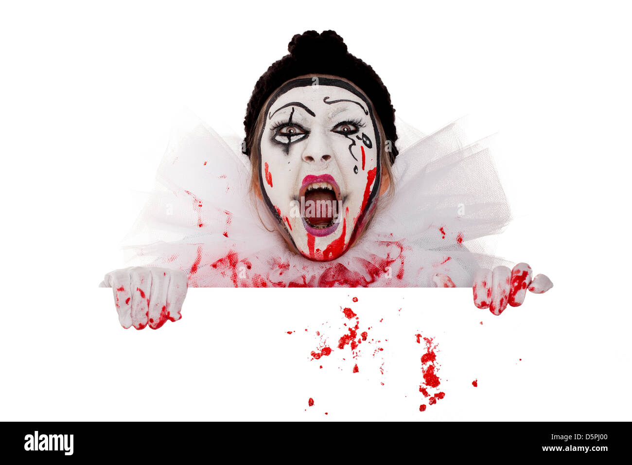 wicked bloody female clown screams over the edge Stock Photo
