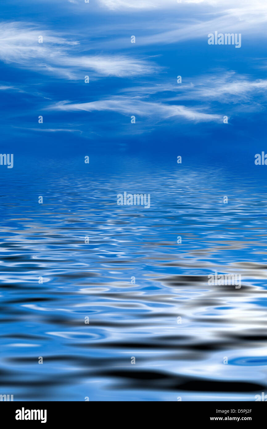 Blue sky with fluffy clouds and water reflection Stock Photo - Alamy